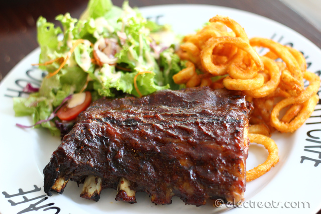 Smoked Pork BBQ Ribs (Half-Rack) - IDR 178K Hog's Style braised pork spare ribs basted in in-house Hickory Smoked BBQ Sauce and served with curly fries (or mash) and salad (or seasonal vegetables). A must-try.