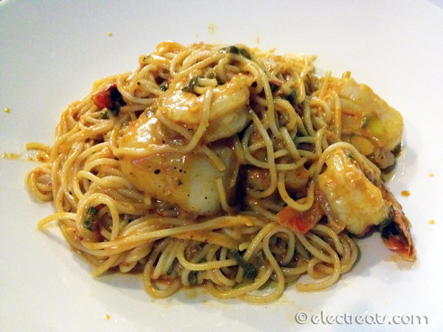 Macaronia tis Mykonou - $32  Prawns, scallops tossed with spaghetti in a light creamy tomato sauce and a dash of chilli.
