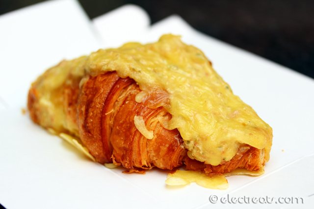 Ham and Cheese Croissant - $6.50 Take-away, $8 Dine-in Croissant filled with house mixture of creamy bechamel sauce, leg ham and topped with cheese. A must-try.